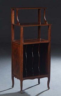 French Louis XV Style Carved Walnut Music Stand, late 19th c., with three graduated shelves on reeded square supports, above a lower shelf with divide