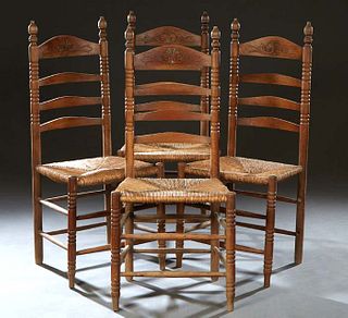 Set of Four French Provincial Carved Oak Ladderback Rush Seat Side Chairs, late 19th c., the arched ladderback flanked by turned finialed supports, to
