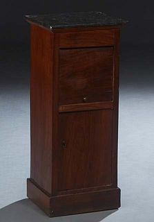 Unusual American Carved Mahogany Marble Top Nightstand, late 19th c., the black marble top over a tambour front pot cupboard with a figured marble ins