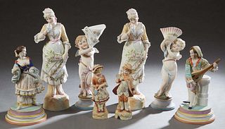 Eight German Polychromed Bisque Figurines, late 19th/early 20th c., consisting of a small pair of boy and girl figures, signed "DL" under the base, H.