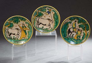 Three Spanish Ceramic Plates, 20th c., Talavera, with hand painted decoration, two with bulls and one a man on horseback, verso marked Puente Arzobisp