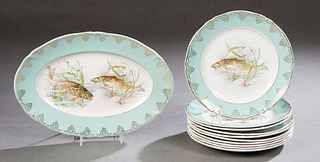 Eleven Piece French Porcelain Fish Set, early 20th c., by St. Amand, the scalloped gilt rims around a wide pale aqua band with gilt tracery decoration