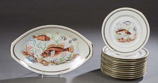 Thirteen Piece French Porcelain Fish Set, 20th c., by P.L., consisting of twelve circular plates and a matching oval platter, each with transfer fish 