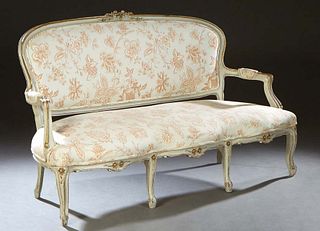 French Louis XV Style Polychromed Beech Canape, 20th c., the arched floral carved crest rail over an upholstered back flanked by upholstered arms abov