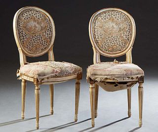 Pair of Polychromed French Louis XVI Style Side Chairs, 20th c., the oval cushioned medallion back over a bowed cushioned seat, on turned tapered cyli