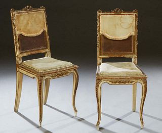 Pair of French Louis XV Style Gilt and Polychromed Ballroom Chairs, late 19th c., the wreath and floral carved crest rail over an upholstered caned ba