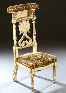 French Provincial Carved Polychromed Beech Louis XVI Style Prie Dieu, late 19th c., the upholstered arm rest over open storage above a pierced vertica
