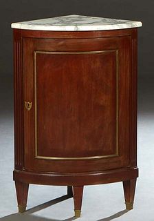 French Louis XVI Style Carved Walnut Marble Top Corner Cabinet, 19th c., the ogee edge highly figured white marble above an ormolu mounted convex cupb