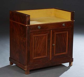 Diminutive French Empire Carved Walnut Server, 19th c., the 3/4 galleried top over a frieze drawer above double cupboard doors, on a plinth base with 