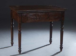 French Provincial Carved Walnut Petrin, 19th c., the hinged top over an incise carved skirt, on turned tapered cylindrical legs, H.- 31 in., W.- 36 1/