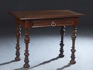 French Carved Oak Louis XIII Style Writing Table, late 19th c., the stepped edge rectangular top over a single frieze drawer, on turned tapered legs w