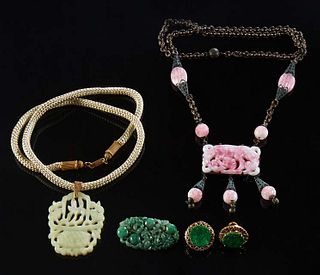 Four Pieces of Chinese Carved Jade Jewelry, 20th c., consisting of a pair of 14K yellow gold circular pierced earrings; an oval brooch with a pierced 