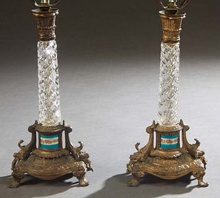 Pair of French Crystal and Porcelain Candlestick Lamps, 20th c., with tapered relief crystal supports to relief bases with inset porcelain bands, on a