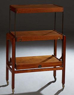 Unusual Mid-Century Modern Carved Mahogany Metamorphic Serving Cart, 20th c., the three tiers collapsing to produce a wide table, on square legs with 
