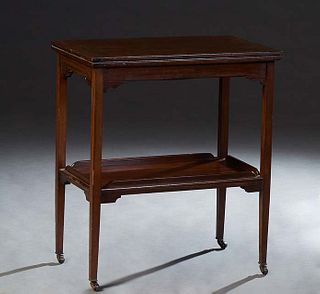 English Carved Mahogany Flip Top Games Table, early 20th c., the ogee edge top opening to an inset baize lined gaming surface, swiveling over open sto