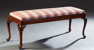 Queen Anne Style Carved Mahogany Long Bench, 20th c., the upholstered cushioned top on a stepped plinth on cabriole legs with pad feet, now in a rose,