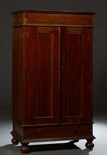 French Provincial Louis XIII Style Carved Mahogany Armoire, 19th c., the stepped crown over double doors with incised panels, over a bottom drawer, on