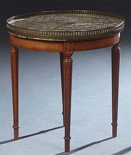 French Carved Walnut Marble Top Bouillotte Table, 20 th c., with a brown Breche d'Alpes circular marble within a pierced brass gallery, over a wide sk