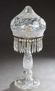 Cut Glass Mushroom Lamp, c. 1940, the peaked shade with cut and etched floral, leaf, and hobnail decoration, on a prism hung support ring, on a taperi