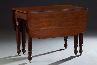 French Provincial Carved Cherry Drop Leaf Table, 19th c., the ogee edge top flanked by two shaped leaves, with a frieze drawer on one end, on large ri
