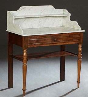 French Provincial Carved Beech Marble Top Washstand, the shelved galleried figured dished white marble on a base with a long frieze drawer, on turned 