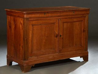 French Provincial Louis Philippe Carved Walnut Sideboard, 19th c., the rounded corner top over two cavetto frieze drawers above large double cupboard 
