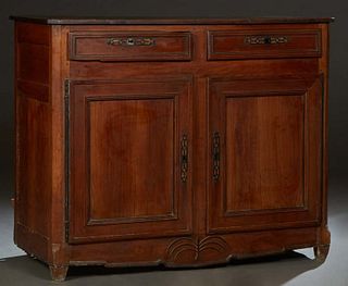 French Provincial Louis XV Carved Cherry Sideboard, 19th c., the canted corner top over two frieze drawers above large double cupboard doors with iron