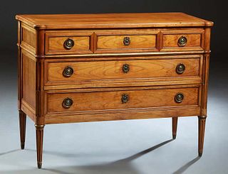 French Louis XVI Style Carved Cherry Commode, early 20th c., the ogee edge cookie corner rectangular top over three setback drawers flanked by rounded