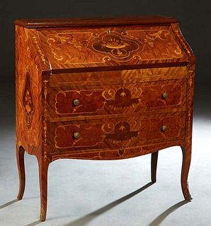 Louis XV Style Marquetry Inlaid Mahogany Slant Front Desk, 20th c., the ogee edge rectangular top over a fall front enclosing three fitted drawers, ab