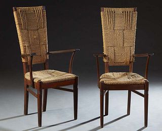 Pair of French Carved Oak Provincial Armchairs, early 20th c., the vertical canted trapezoidal woven rope back to curved arms over a woven rope seat, 