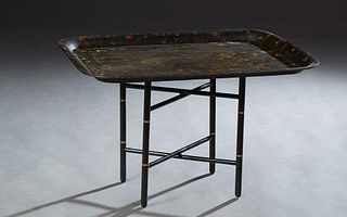 Large English Tole Tray, 20th c., hand painted with flowers, on a later gilt and ebonized folding stand for use as a coffee table, H.- 19 1/4 in., W.-