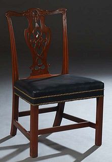 English Chippendale Style Carved Mahogany Side Chair, 19th c., the arched serpentine crest rail over a vertical pierced splat, to a trapezoidal dark b