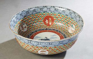 Large Japanese Imari Porcelain Punch Bowl, 20th c., with a blue floral border over intricate painted decoration and reserves of children, H.- 5 7/8 in