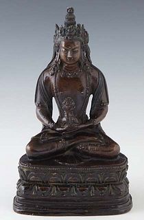 Oriental Patinated Bronze Tara Buddha Figure, 19th c., seated cross legged on a stepped cushion base, H.- 9 3/4 in., W.- 5 1/2 in., D.- 4 in.