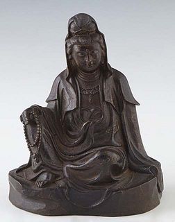 Tibetan Seated Patinated Bronze Royal Guanyin, 19th c., on an integral bronze base, H.- 5 3/4 in., W.- 4 3/8 in., D.- 3 in