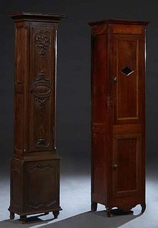 Two French Provincial Carved Walnut Tall Case Clock Cases, 19th c., now lacking the tops and movements, H.- 70 in., W.- 16 1/4 in., D.- 12 1/2 in.