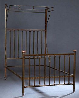English Brass Half Tester Double Bed, c. 1910, the half tester over a cylindrical spindled headboard, flanked by turned cylindrical posts, to iron rai