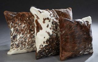 Group Of Three Decorative Cowhide Throw Pillows, 20th c., with zippered sides, One- H.- 18 3/4 in., W.- 18 3/4 in.; One- H.- 14 1/2 in., W.- 14 1/2 in