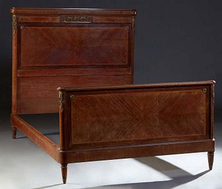 French Louis XVI Style Inlaid Mahogany Ormolu Mounted Double Bed, early 20th c., the crotched ormolu mounted headboard to wood rails and an ormolu mou