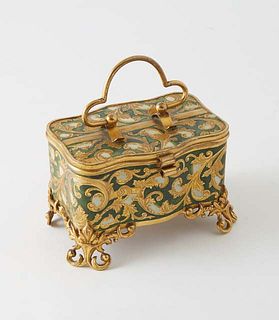 Enamel and Gilt Brass Ring Box, early 20th c., of serpentine form, the top with a folding brass handle, with scrolled leaf decoration, on pierced doub