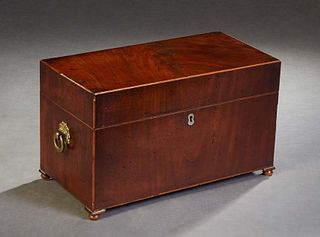 English Victorian Line Inlaid Carved Mahogany Tea Caddy. 19th c., the sides with brass ring handles, the front with a mother-of-pearl escutcheon, on w