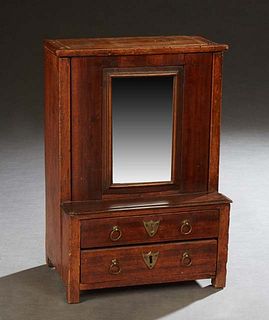 Unusual English Carved Mahogany Jewelry Box, 19th c., in the form of a miniature dresser, the upper section with a sliding mirror opening to two inter
