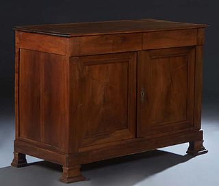 French Provincial Louis Philippe Carved Walnut Sideboard, 19th c., the stepped rounded edge top over two large frieze drawers above double cupboard do
