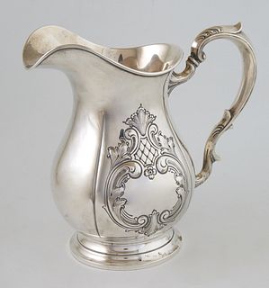 Fisher Sterling Pitcher, #2005, Hand Chased, the sides with repousse scroll and leaf decoration, H.- 9 1/4 in., W.- 6 in., D.- 9 3/4 in., Wt.- 24.25 T