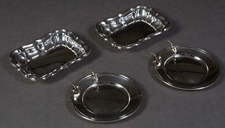 Four Pieces of Sterling, 20th c., consisting of two Gorham bread plates with attached knife rests; and two Reed and Barton "Windsor" pattern rectangul