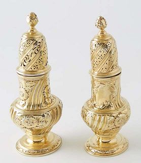 Pair of English Gilt Sterling Salt and Pepper Shakers, 19th c., with pierced and repousse decoration, with a Maker's mark of "JW," H.- 7 5/8 in., Dia.