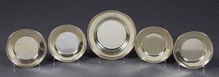 Set of French First Standard Silver Gilt Washed Bread Plates, late 19th c., with beaded rims, consisting of four smaller plates, and a larger matching