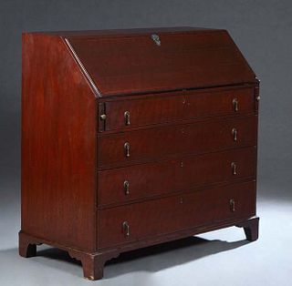 Large English Carved Inlaid Mahogany Slant Front Desk, 19th c., the slanted baize inset lid opening to an interior fitted with open storage, seven dra