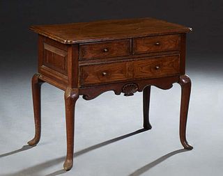 English Inlaid Oak Lowbody, 19th c., the ogee edge top over two frieze drawers above a long drawer, over a shell caved skirt, on cabriole legs with po