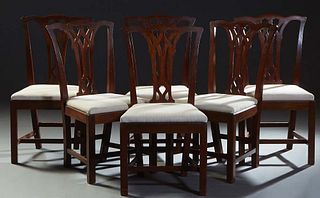 Set of Six Chippendale Style Carved Mahogany Side Chairs, 20th c., the serpentine crest rail over a pierced intertwined vertical splats to trapezoidal